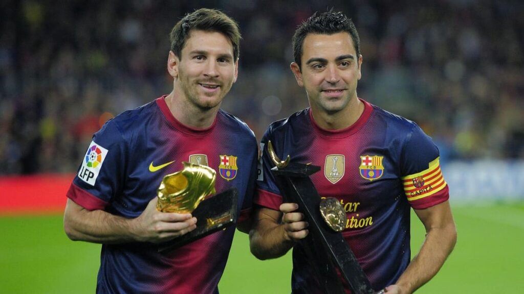 Messi y Xavi.